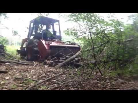 Equipment reclaiming an overgrown field edge